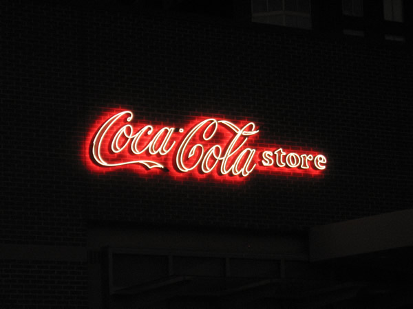 light escaping from the Coca cola sign into the br